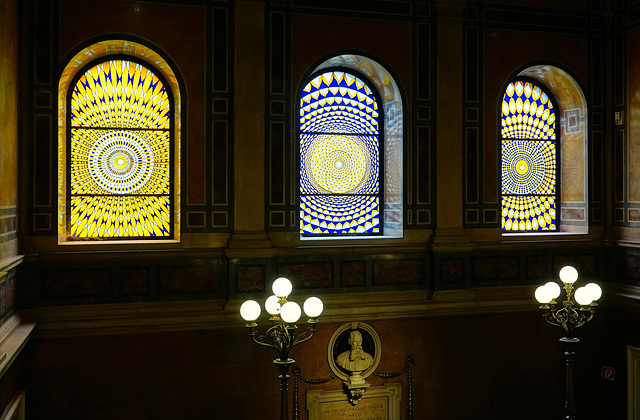 Stained-glass window at the top of the stairs