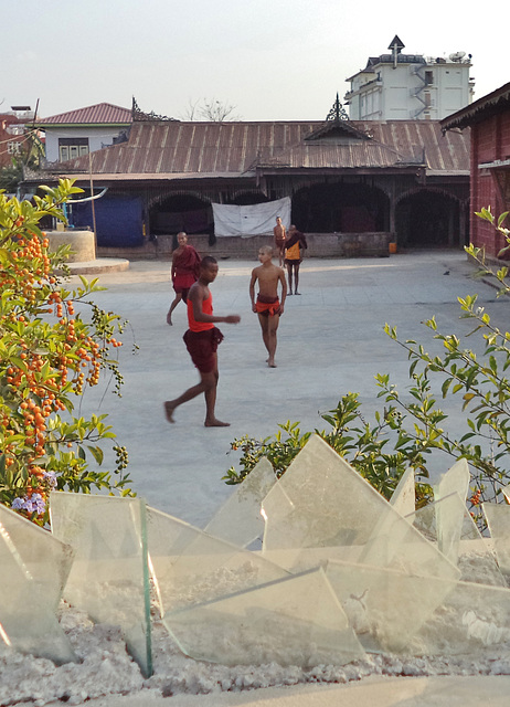 young monks playing soccer