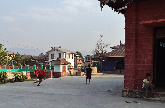 young monks playing soccer