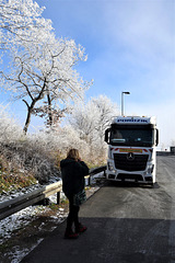 White trees, a lorry from Poland, and an important phone call next to the fence!