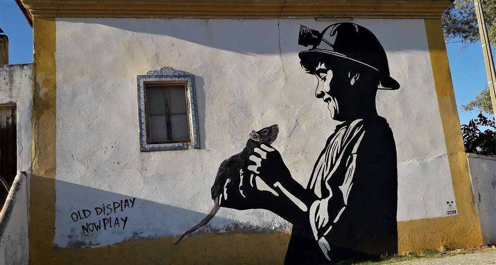 Mural of the miner and the rat.