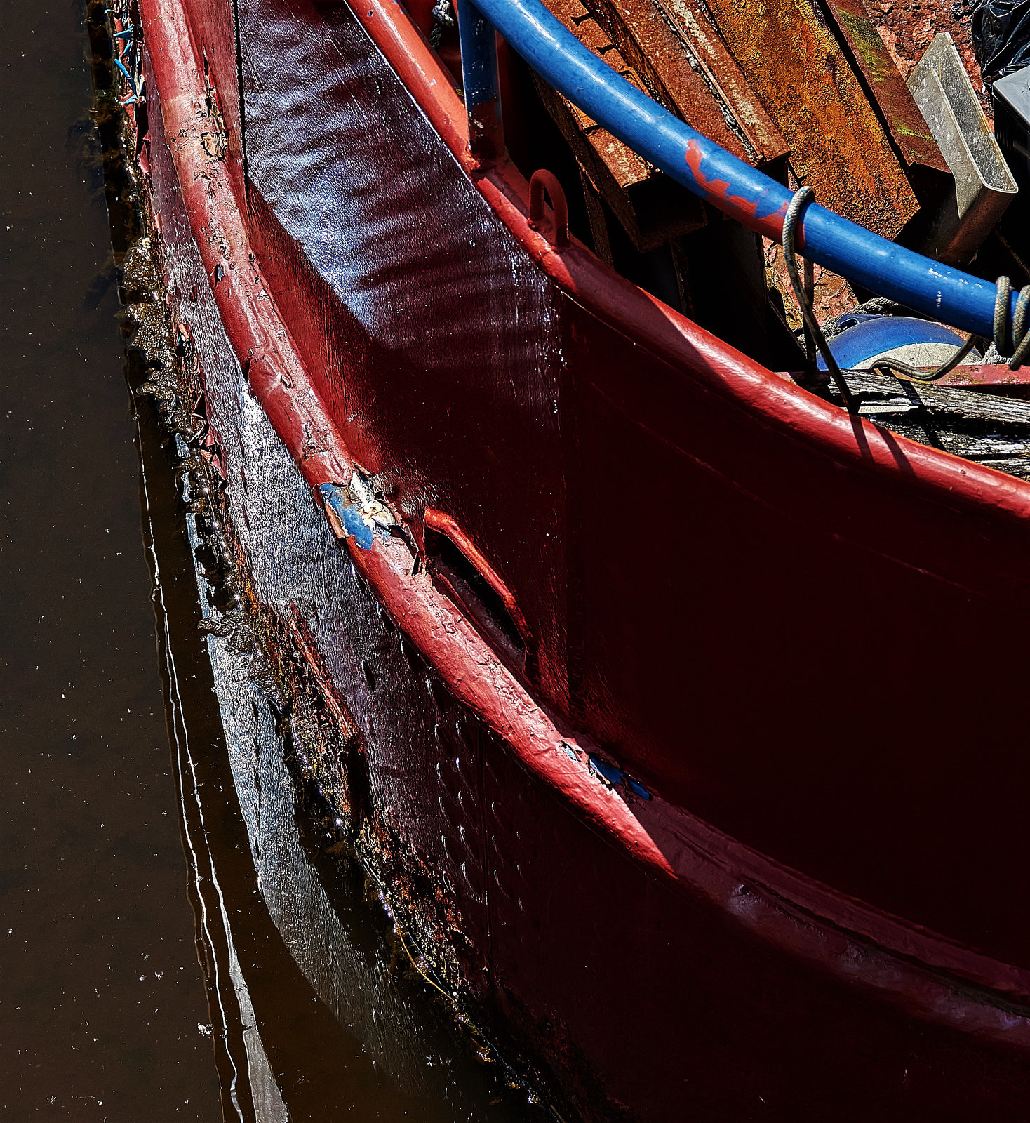 A Boat. Light, Ripples, Rust And Rot