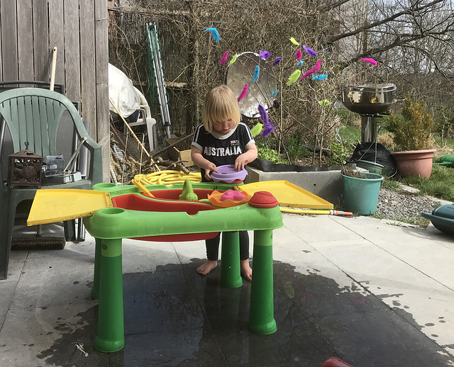 Aude playing with the toy garden set