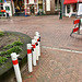 Poles waiting to be used to close the street