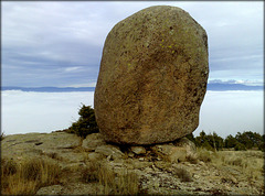 Granite boulder above a sea of fog.