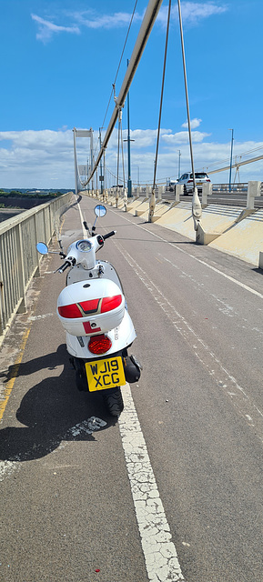 Scooter riding on the Severn Bridge