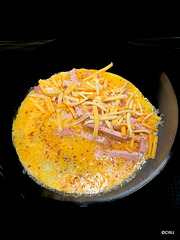 Cheese and ham omelette (in the process of being made)does not qualify as diet food!