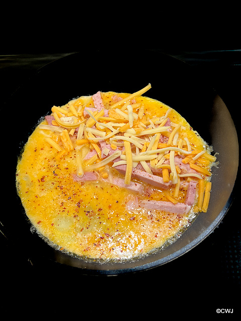 Cheese and ham omelette (in the process of being made)does not qualify as diet food!