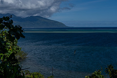 After a short hike and climb, looking south-east to the coast of Taiarapu-Ouest, the appendix on the island of Tahiti. Note the lone wind-surfer.