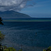 After a short hike and climb, looking south-east to the coast of Taiarapu-Ouest, the appendix on the island of Tahiti. Note the lone wind-surfer.