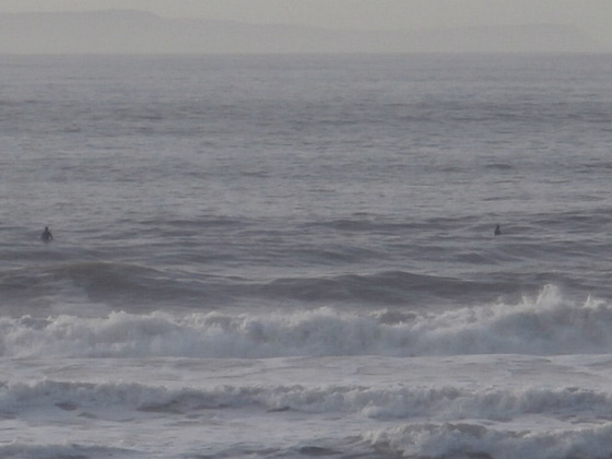 The odd surfers out there - but the sea was quite messy with lots of waves