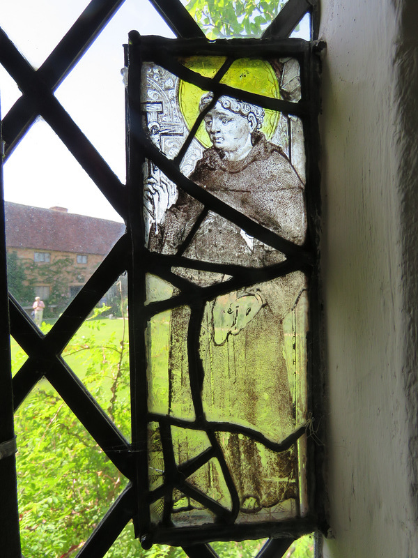 sissinghurst castle, kent   (8)late c16 saint in glass on the tower stair, possibly st francis