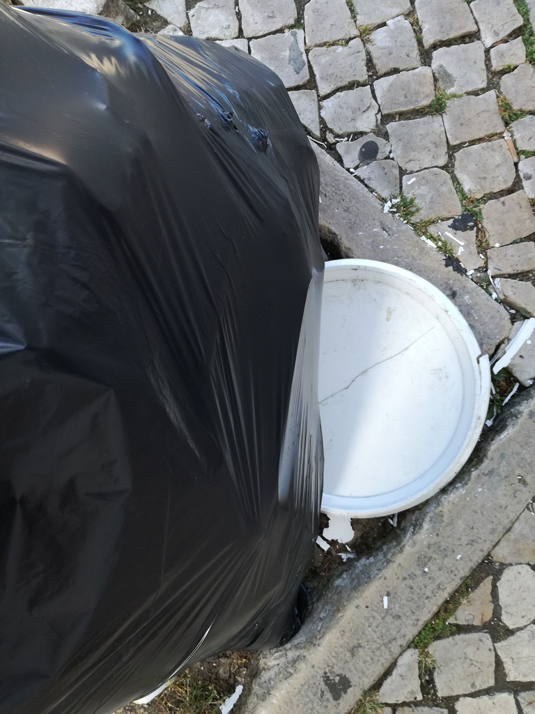 Someone leans the garbage bag against the tree so that dogs don't piss on the trunk