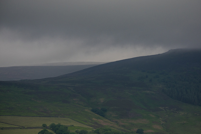 Clouds touching the hilltops