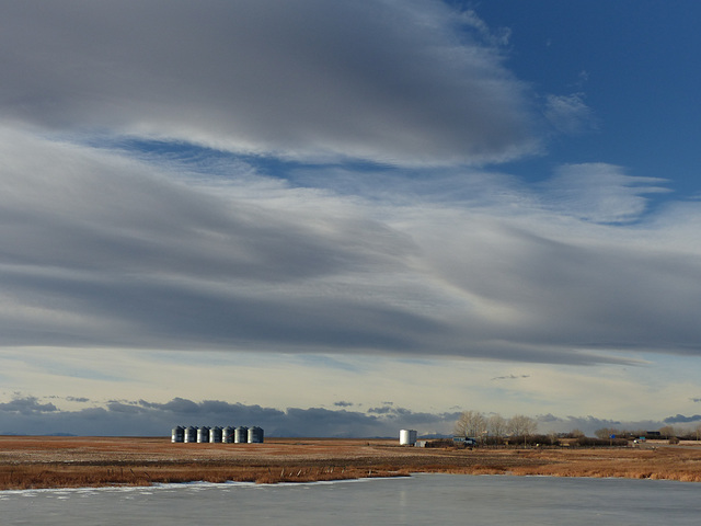 Chinook clouds over a Prairie farm