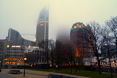 Buildings disappearing into the clouds