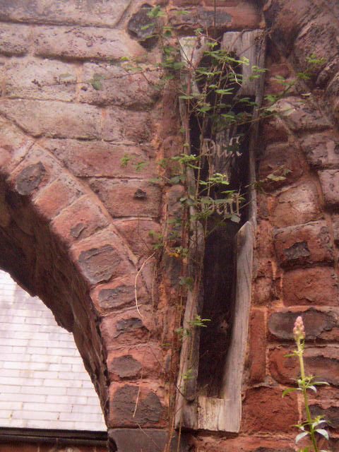 Coffin inserted on wall.