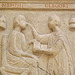 Detail of a Side of the Sosia Family's Sarcophagus with an Eye Examination Scene Replica in the Museum of Roman Civilization in EUR, July 2012