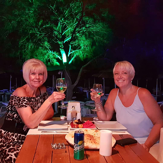 Mandi and her close friend Eve enjoying a meal out on the beach