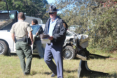 # 4 ..in blue, a Georgia State Trooper,  facing away is our son with local Sheriff Department, my ruined Ford in background. :(