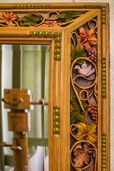 Carved wooden frame and mirror, detail