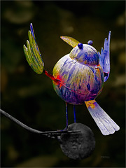 A rainbow coloured iron bird