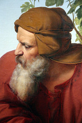 L'homme barbu et enchaîné jouant de la lyre , il personnifie le prophète Jérémie . L'homme barbu et enchaîné jouant de la lyre , il personnifie le prophète Jérémie .