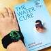 Reading with crocheted FitBit wristband
