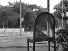 Worn out chair at the bus stop