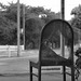 Worn out chair at the bus stop
