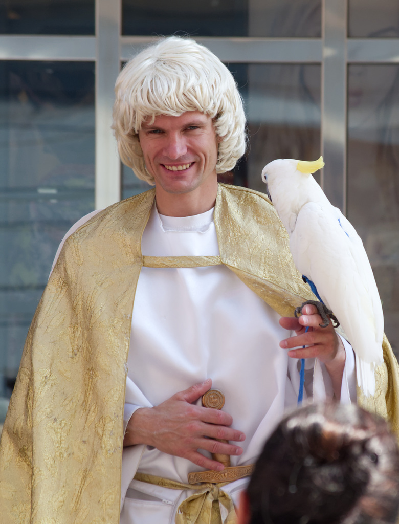 Man in costume with parrot