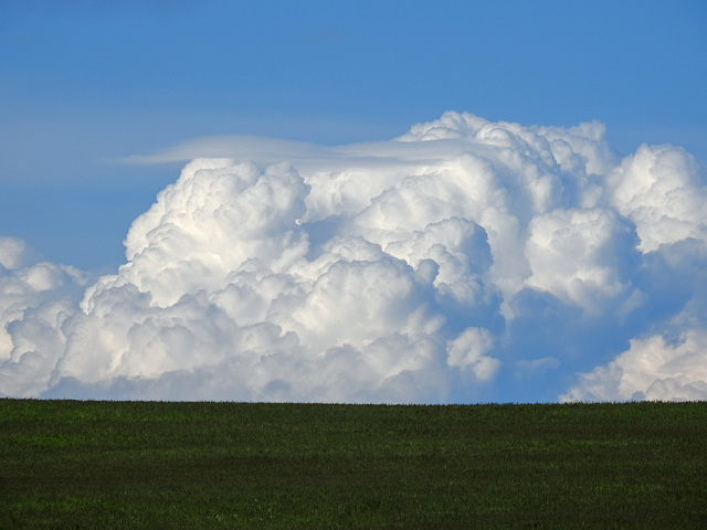 Billowing clouds over the hill