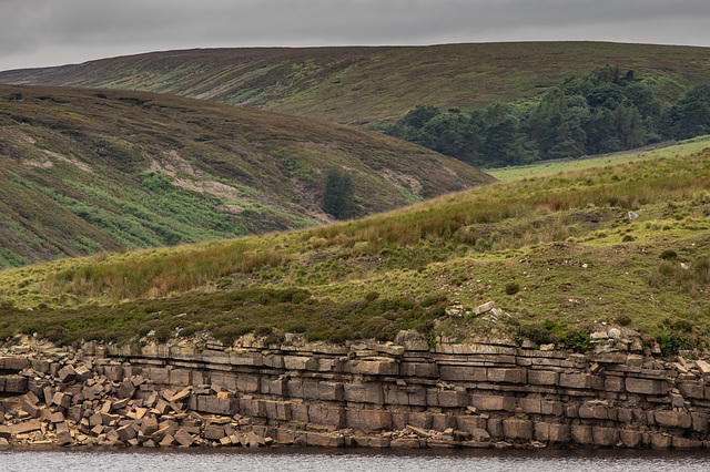 Exposed rock across Winscar Reservoir