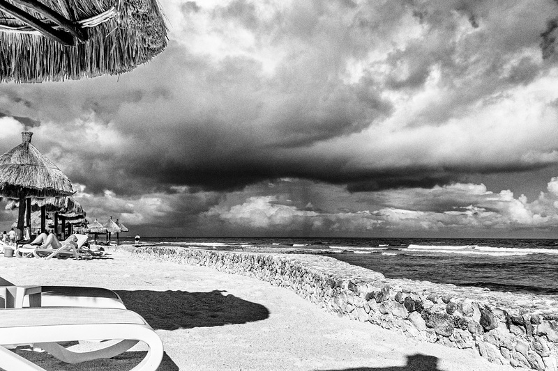 beach sea clouds fence and legs bw