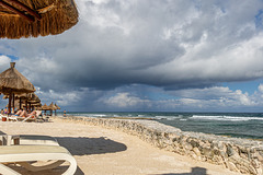 beach sea clouds fence and legs