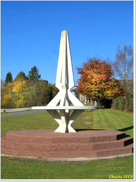 Monumental sundial at the village entry