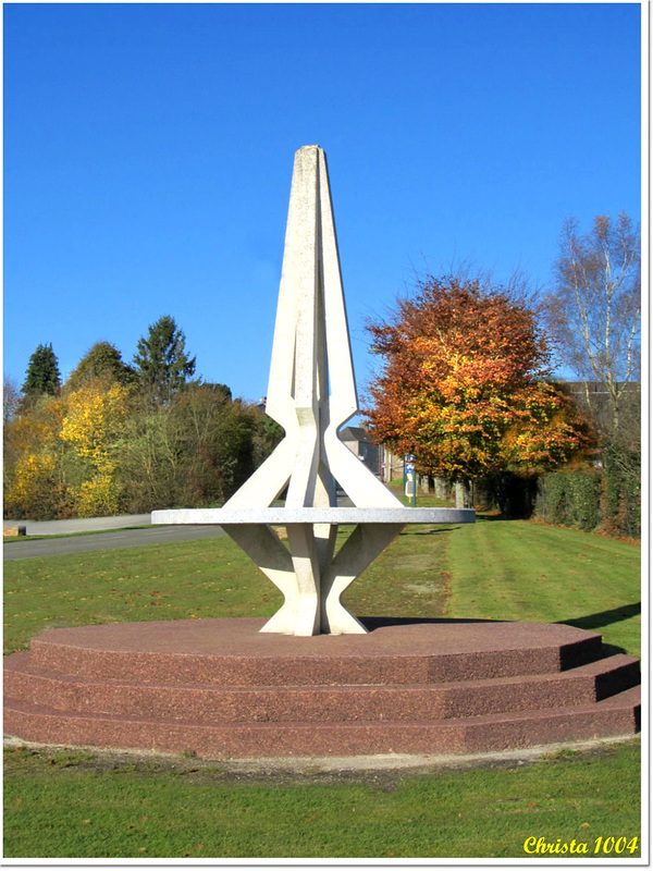 Monumental sundial at the village entry