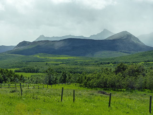 Rolling hills and distant peaks