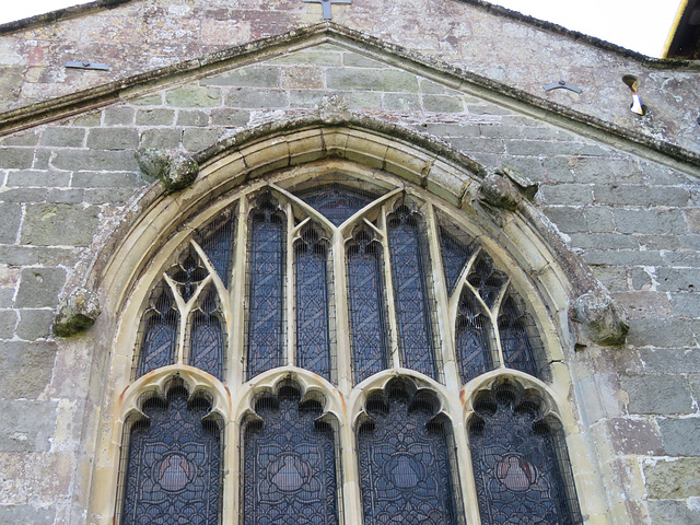 mere church, wilts c14 heads around a c15 window , east end of south chapel
