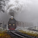 Locomotive 99-7232-4 emerges from fog,