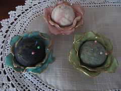 felted balls in ceramic vases