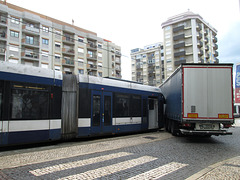 Tram collides with trailer of lorry.