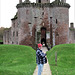 Caerlaverock Castle's wall (and a gentleman with red hat)