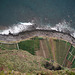 Looking down at neat coastal farmland