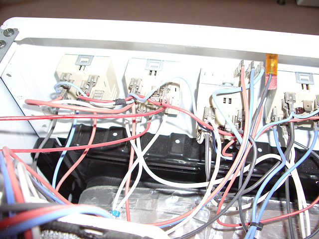 Oven with lots of wires and switches