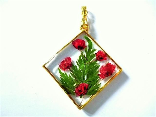 Diamond shape with red flowers and leaves