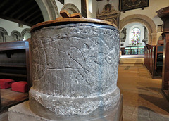 tissington church, derbs (32)c12 font, beast with knotted tail eating a man