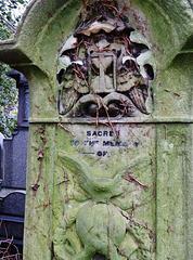 abney park cemetery, london,c19 memorial with hourglass still crisp when all else has been smoothed away
