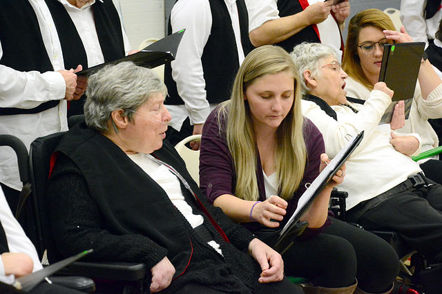 The choir was aided by musical assistants.