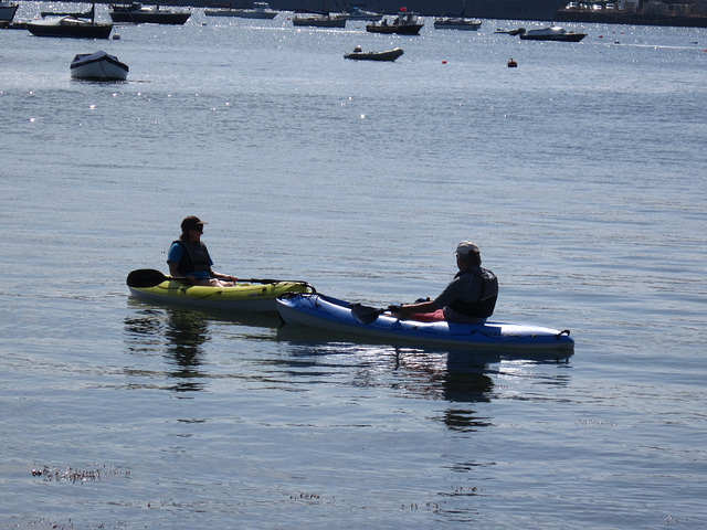Two canoeists enjoying the warm weather